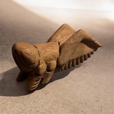 hand-carved wooden cricket, often utilized as a guiro musical instrument