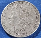 A 1878 MORGAN SILVER DOLLAR 7/8 STRONG TAIL FEATHERS.