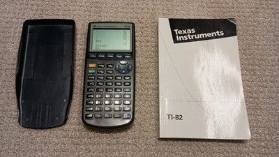 Texas Instruments TI-83 Handheld Graphing Calculator with Manual.