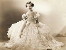 Actress Lily Pons smiling and wearing a white ruffled dress Old Photo