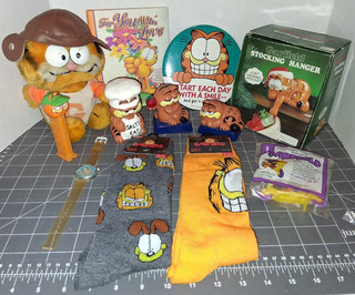 Lotto Garfield calze appendiabiti gatto arancione grasso pez libro bottone aviatore peluche