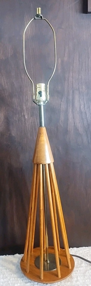 A large 1960s Danish teak cone lamp — clean Scandinavian lines with serious vintage provenance and the warm wood grain to match.