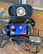 Sony PSP-100 Black Handheld Console Wi-Fi with Charger, Case, UMD Game