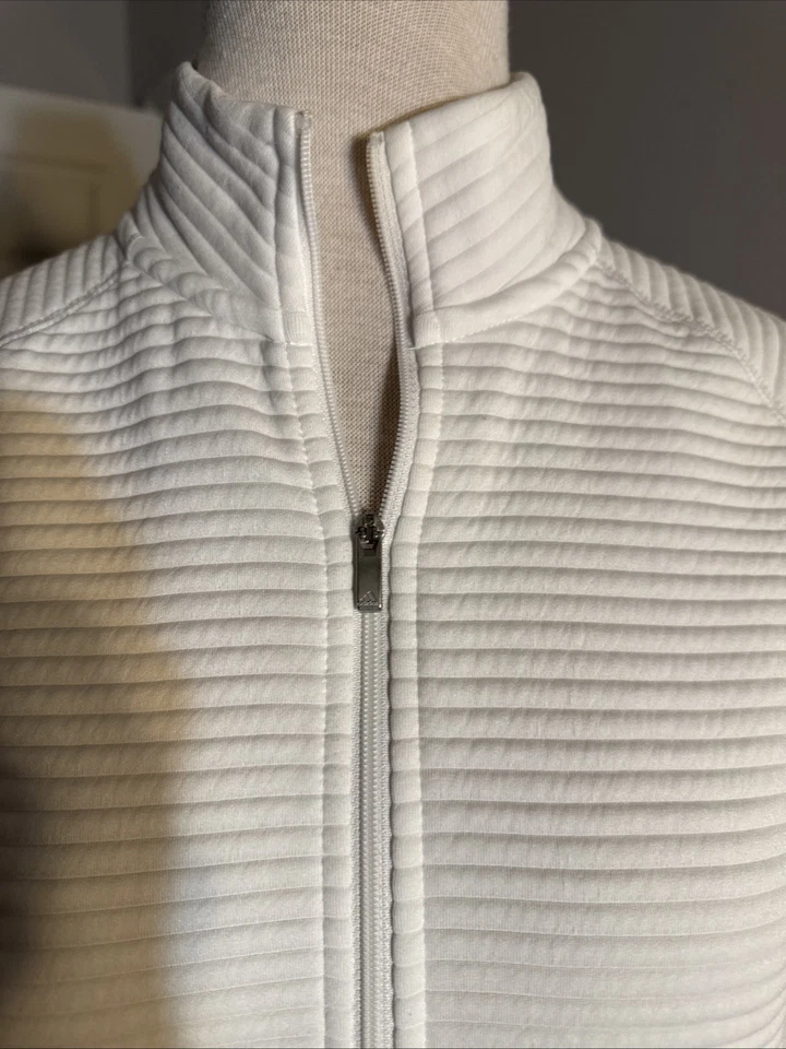 Chaqueta Adidas Para Mujer Golf Blanca Essentials Med Frontal Cremallera Mangas Largas Bolsillos Foto 3 de 4
