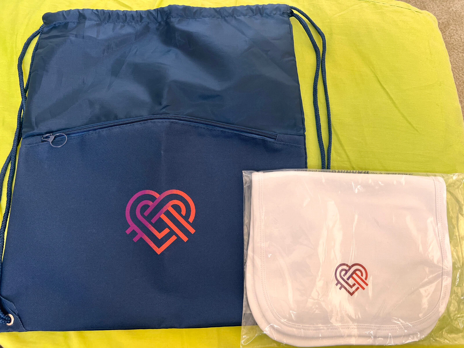blue string bag and white burp cloth