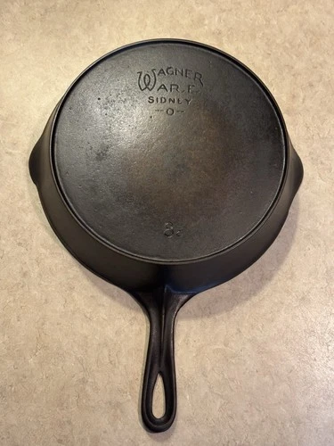 Wagner Ware Sidney -O- No. 8C  heat ring and no catalog number on the bottom.