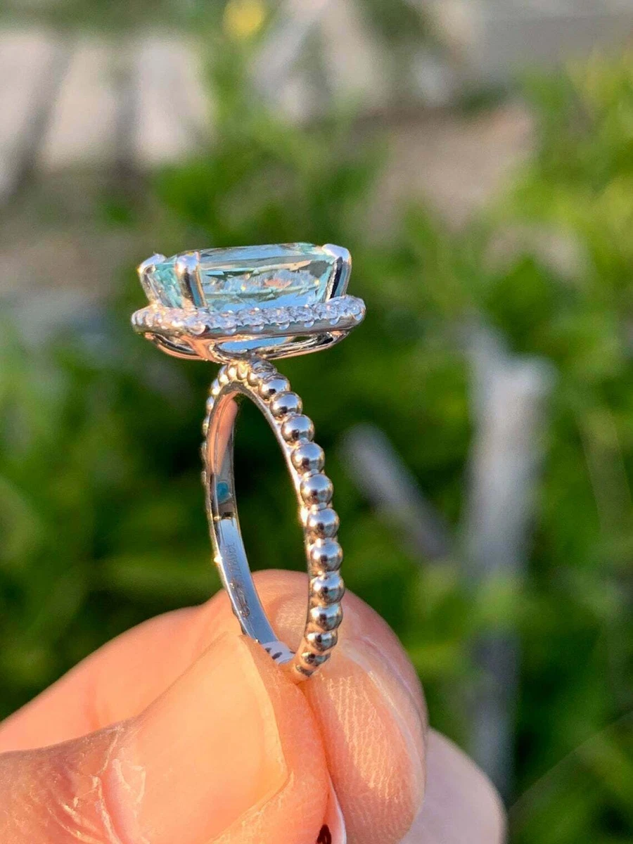Aquamarine diamond hotsell halo ring