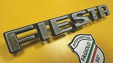 BADGE" FIESTA" LOGO FREGIO FORD STEMMA PLASTICA NERA SCRITTA CROMATA FIESTA 2S.