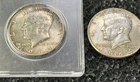 2 1964 Silver Kennedy half dollars minted in Philadelphia.