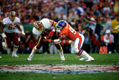 Ricky Hunley Denver Broncos tackles Dave Truitt Washington R Football 1988 Photo