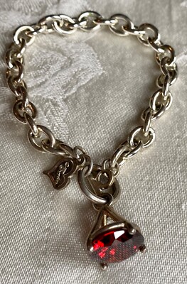 Vintage bracelet signed TM Giftcraft, silver tone with red faceted stone