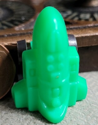 Vintage plastic GREEN LITTLE SPACE SHUTTLE TOY, wheels move