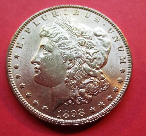 1898 MORGAN SILVER DOLLAR. UNCIRCULATED. HIGH GRADE.