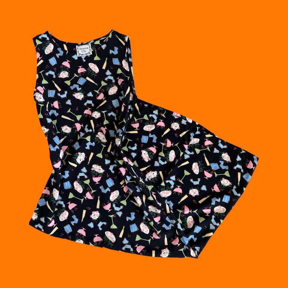 A sleeveless maxi dress covered in cocktail prints is the ultimate retro party statement piece — wearable art from the 90s.