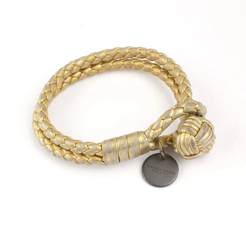 Bracciale Bottega Veneta metallo oro intrecciato pelle tondo ciondolo 12345 26811801