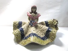 Vintage Faceless Artesania Clay Pottery Girl Sitting On Log Holding Flowers