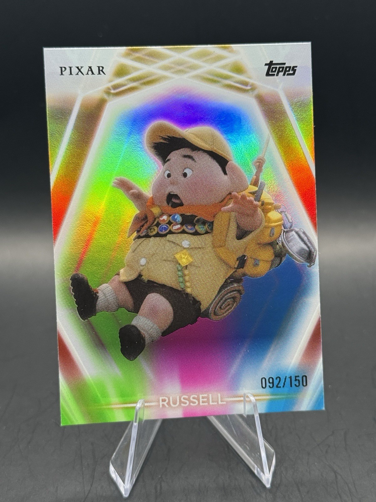 2026 Topps Disney Neon Russell #130 Pink Green Blue /150