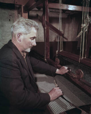 Isle Of Skye Tweed Weaver Crofter weaves tweed cloth with a tradit- 1960 Photo