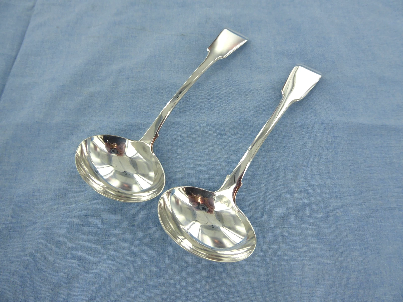 AN ANTIQUE PAIR OF STERLING SILVER, FIDDLE BACK SAUCE LADLES, LONDON 1847.
Opens in a new window or