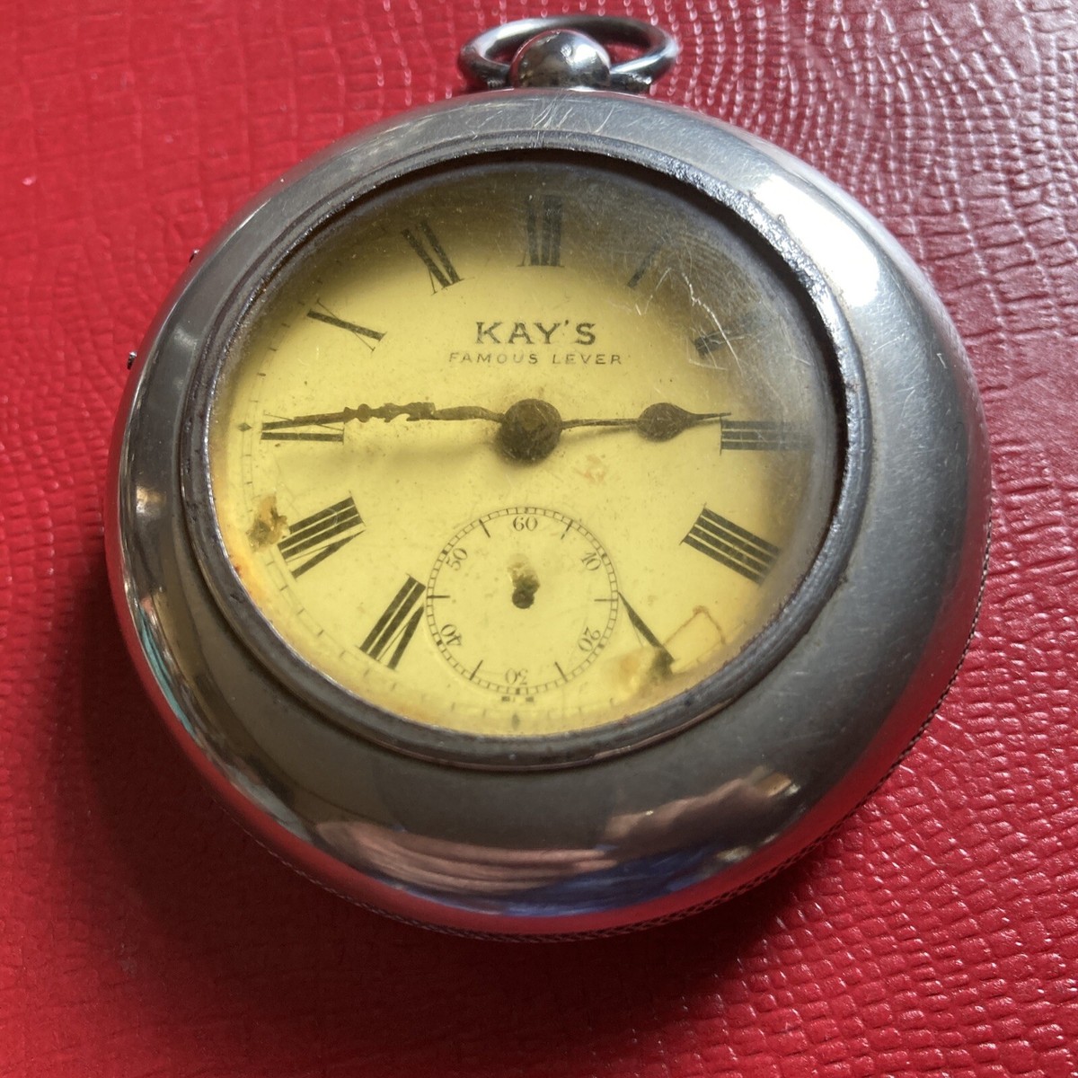 large silver pocket watch with Kay’s Famous Lever