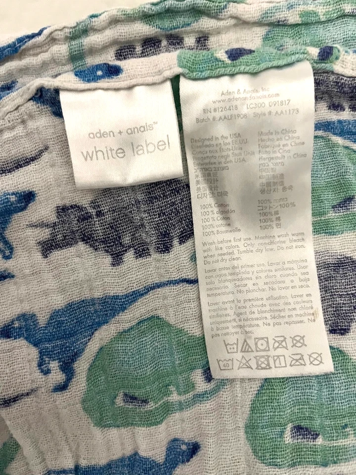 Manta de muselina dinosaurio verde azul Adén + Anais bebé etiqueta blanca algodón Foto 2 de 3