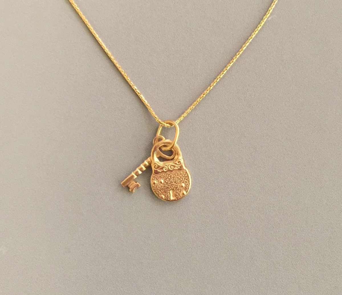 Gold lock 2024 and key necklace