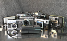 Lot of 8 126 Film Cameras - Olympus, Ricoh, Yashica, Kodak - Read More