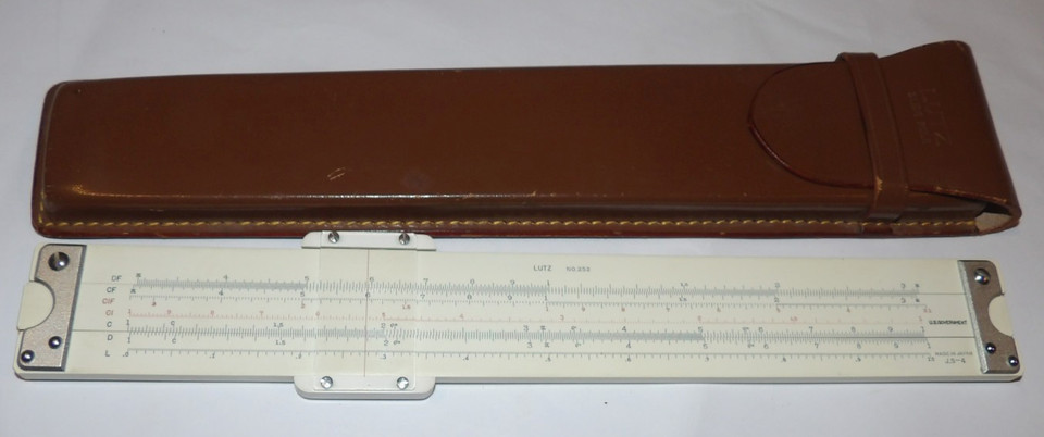 A 1960s U.S. Government-issued Lutz slide rule — the 'property of the federal government' provenance makes this an instant conversation piece and Cold War relic.