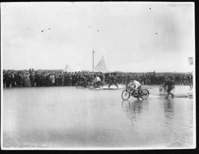 Alexander riding a Douglas motorcycle pulls ahead competition Bris- Old Photo