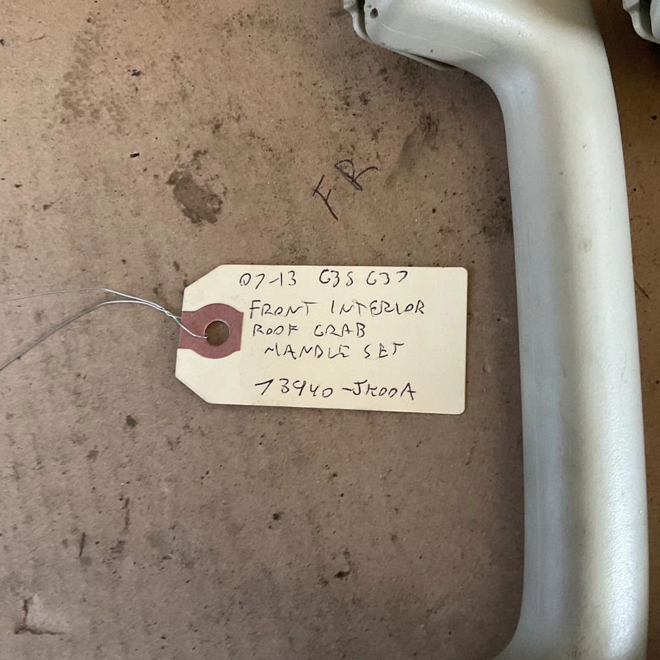 07-13 Infiniti G35 G37 Juego de manijas de agarre de techo interior delantero 73940-JK00A Foto 2 de 4