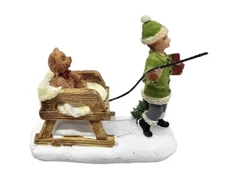 Christmas Village Accessory Figurine  Child Pulling Teddy bear In Sled