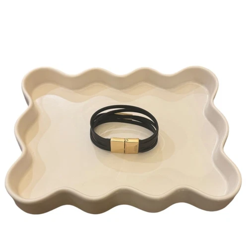 Bracciale Coach vintage in pelle nera e oro