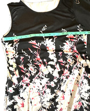 Womens dress, sleeveless size medium, color is black with flower prints, 