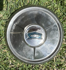 Two Antique Chevrolet Chevy Hubcaps