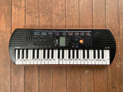 Casio SA-76 Electronic Keyboard, Beautiful orange, black color 100 Tones. Drums