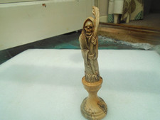 Gothic grim reaper carved from naturally shed deer antler with turned wood stand