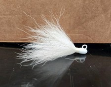 white saltwater bucktail jig from 1/2oz up to...