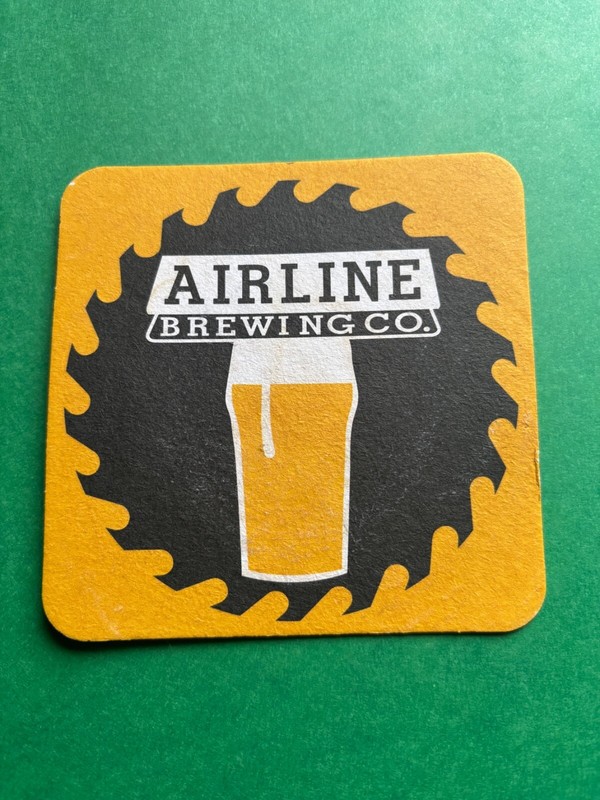 NEW AIRLINE BREWING BEER COASTER ELLSWORTH MAINE SAW BLADE LOGO