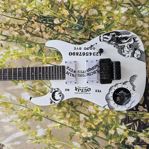 White Electric Guitar With A Moon Pattern On It, The Fingerboard Has Patterns Of