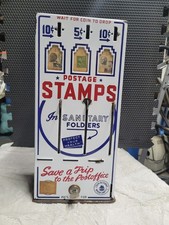 Vintage postage stamp machine (WITH 5 original stamps still enclosed in display)