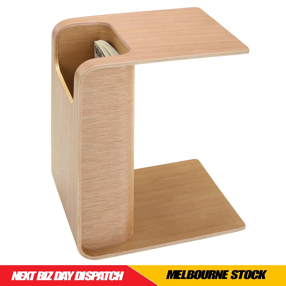 Black/Walnut/Natural oak Side Table slotted over the seat of a sofa Books