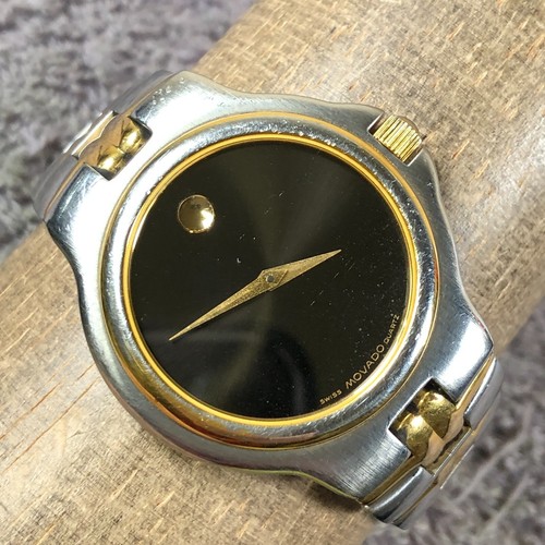 Vintage 1881 Movado Olympian Herren 81E28872 elegante zweifarbige Quarz 34 mm Uhr 6 3/4"