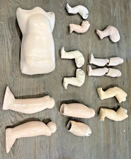 Antique Composition Body Parts - 1 Torso, 11 legs and two leg parts - 16 Pieces