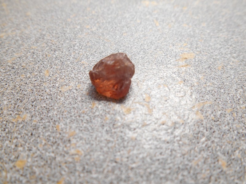 Sapphire  faceting rough.  med. peach-orange color. 3.5 cts. Clean. Umba.