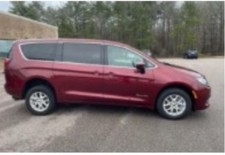 BraunAbility Wheelchair accessible Van. Used 2022. Rear ramp entry. Red