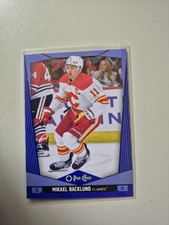2024-25 O-Pee-Chee Mikael Backlund Blue Parallel #294 Calgary Flames 