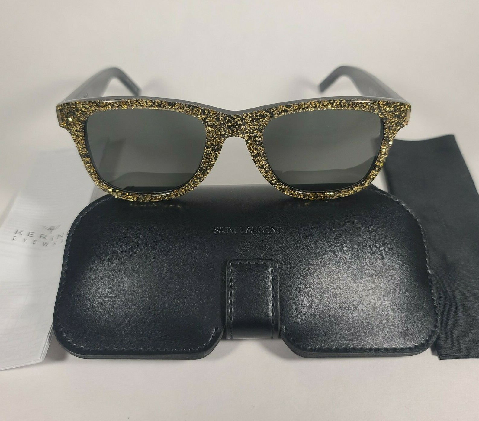 Occhiali da sole donna Saint Laurent SL51 008 montatura nero oro glitter lenti grigie
