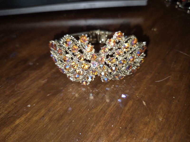 Aurora Borealis flashes of pink & blue Gold Tone Clamper Bracelet Vintage
