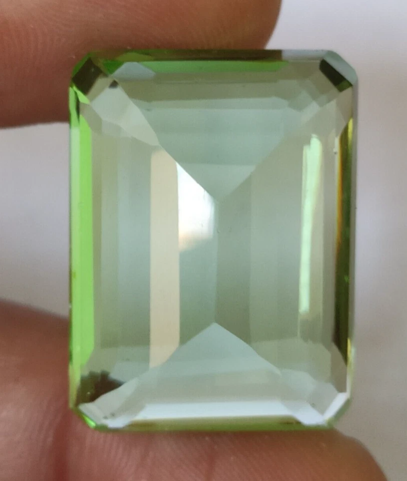 AAA+ 55.50 Ct. Green Peridot Translucent Faceted Emerald Cut Loose Gemstone Ring - Image 4 of 4