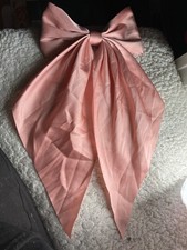 Pink satin clip on bow condition new with imperfections